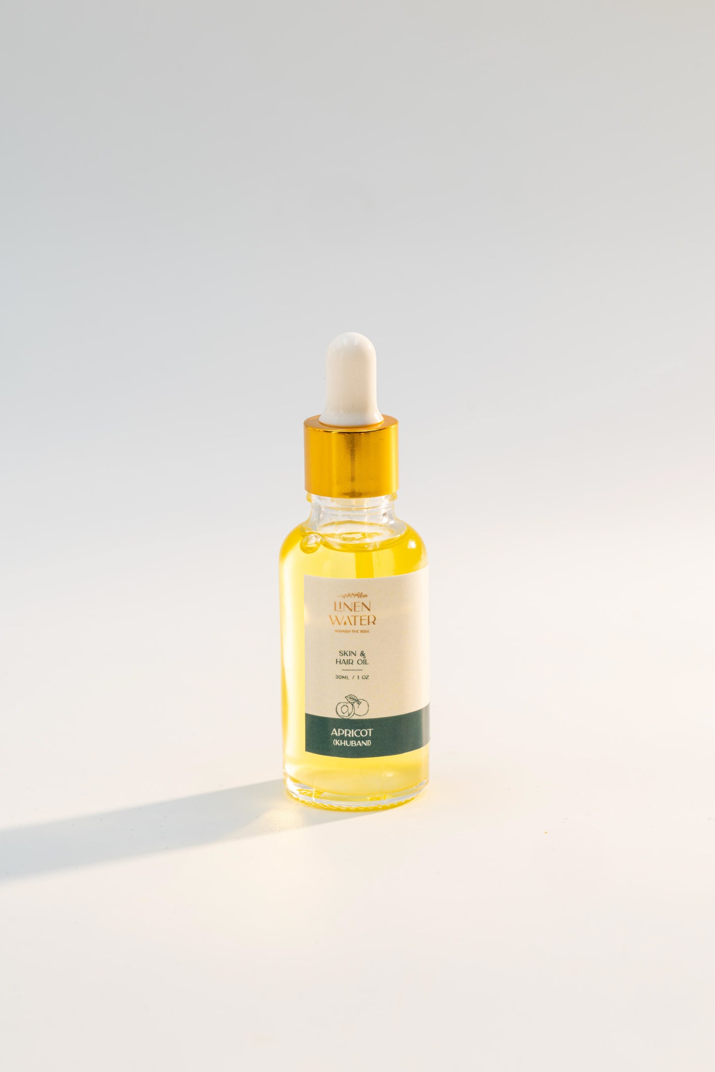 Rich in vitamins A and E, Linen Water Apricot (Khubani) Skin & Hair Oil strengthens hair and provides deep moisture for dry skin. Ideal for smooth, frizz-free hair and soft, glowing skin.