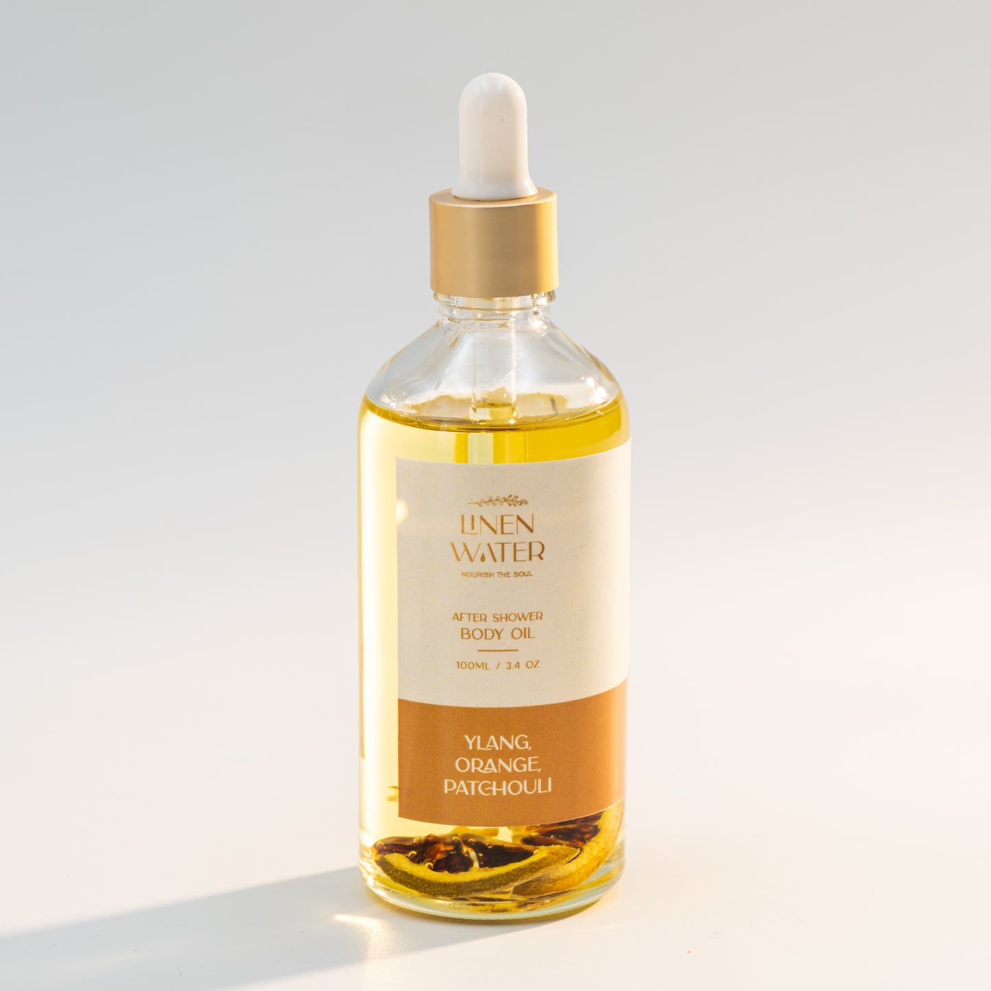 A natural, hydrating body oil that nourishes the skin and improves its natural glow and softness is Linen Water Ylang Orange Patchouli Body Oil. It provides intense moisture, brightness, and a refreshing aroma thanks to its blend of ylang-ylang, orange, and patchouli essential oils.