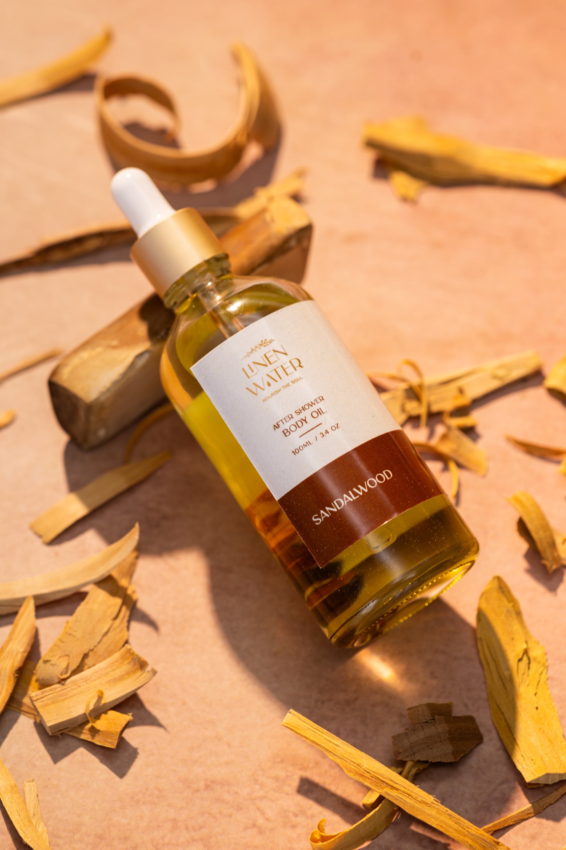 A hydrating after-shower oil that leaves skin feeling smooth and nourished, Linen Water Sandalwood Body Oil has a relaxing sandalwood scent.
