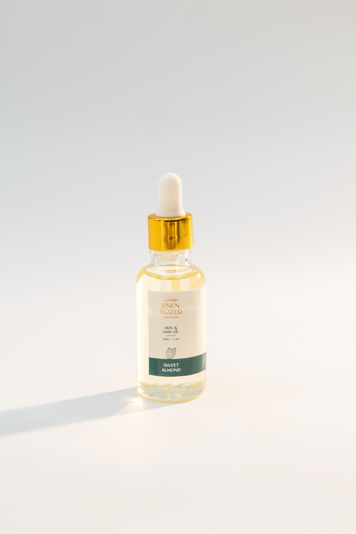 Linen Water's Nourishing Sweet Almond Oil, enhanced with vitamins that promote natural hydration and repair, is ideal for smooth, glowing skin and hair.