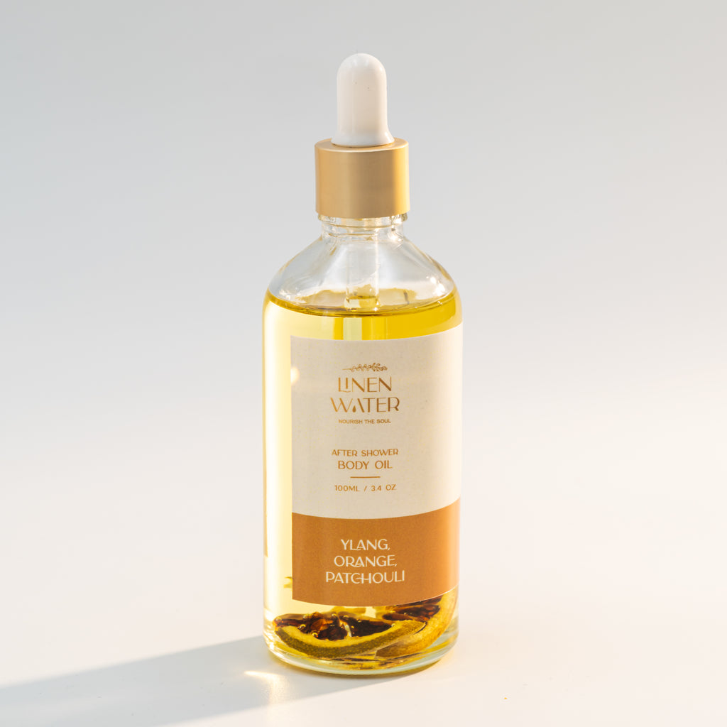 A natural, hydrating body oil that nourishes the skin and improves its natural glow and softness is Linen Water Ylang Orange Patchouli Body Oil.  It provides intense moisture, brightness, and a refreshing aroma thanks to its blend of ylang-ylang, orange, and patchouli essential oils.