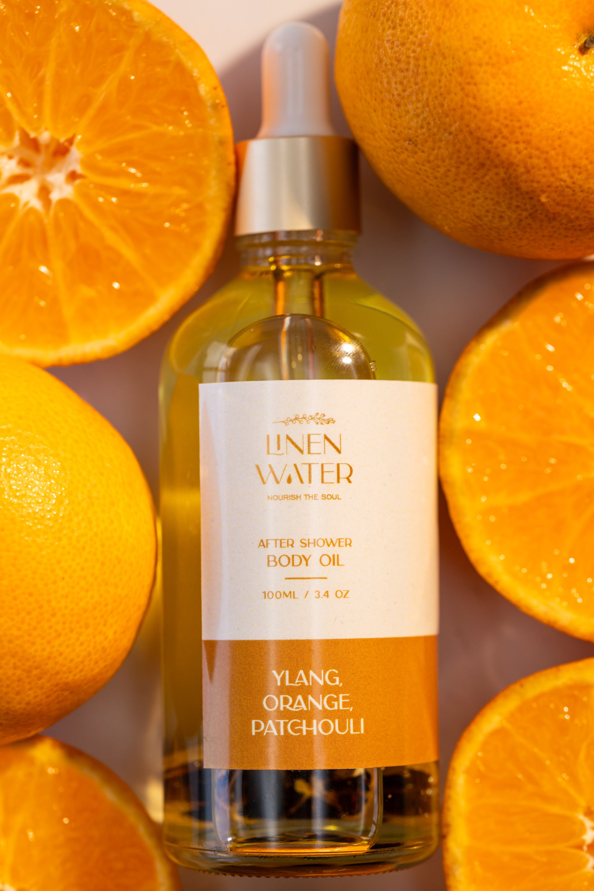 Soft, glowing, and healthy-looking skin is promoted by Linen Water's natural body oil with ylang, orange, and patchouli.